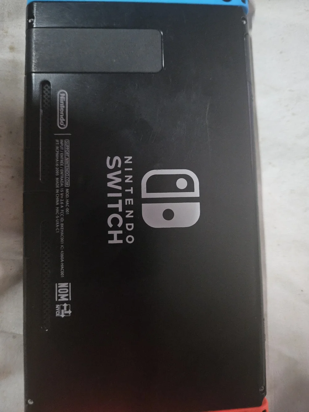 Nintendo Switch Console with Orange Left & Blue Right Joy-Con and Travel Case